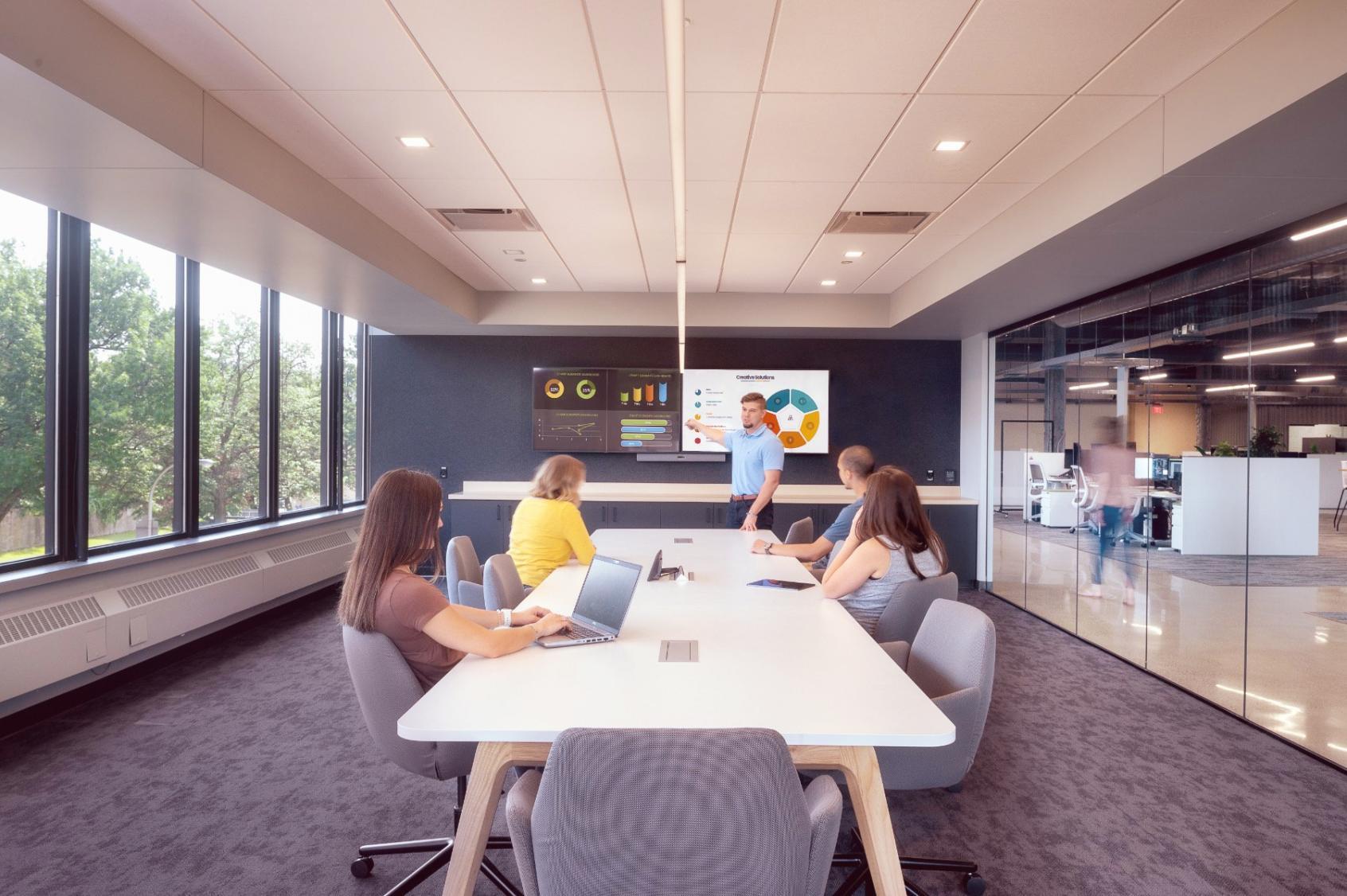 Financial analysis workspace with multiple monitors displaying data